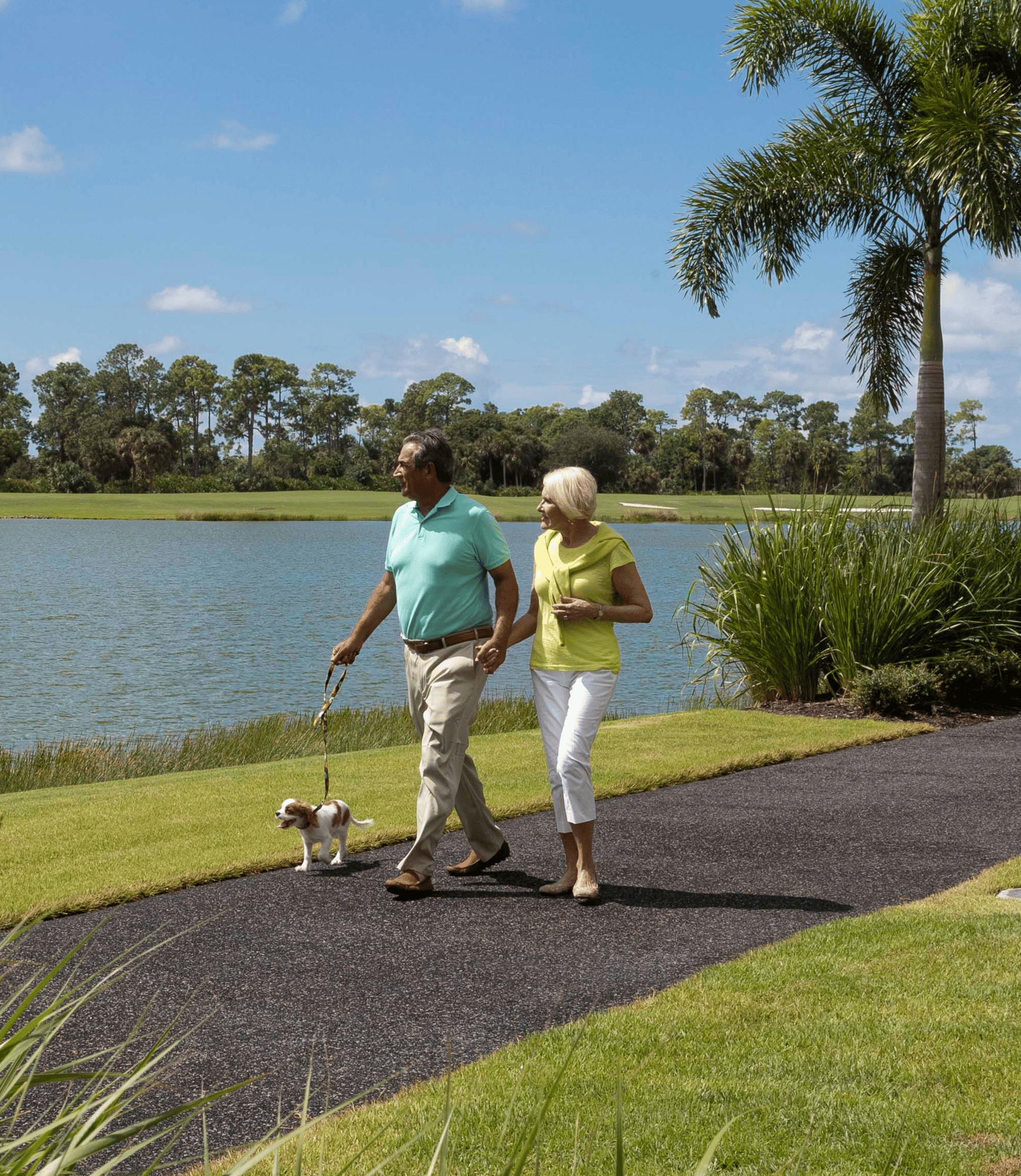 A Couple Walks Their Dog Next to Grande Lake-1