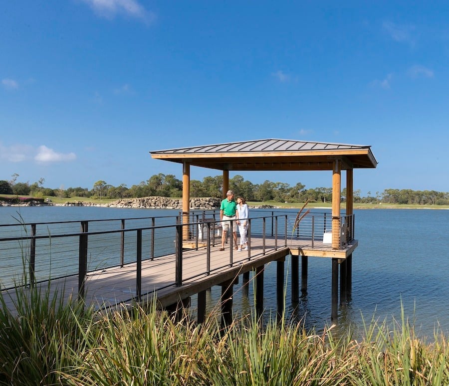 A Couple Walks on the Pier by Grande Lake