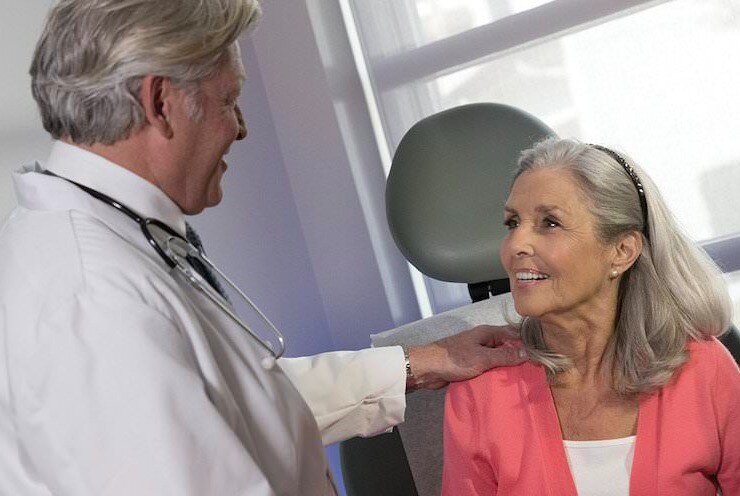 Doctor and patient smiling